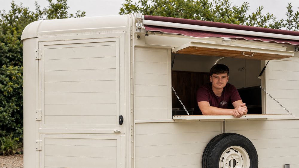 Tom serving from The Pizza Club trailer hatch