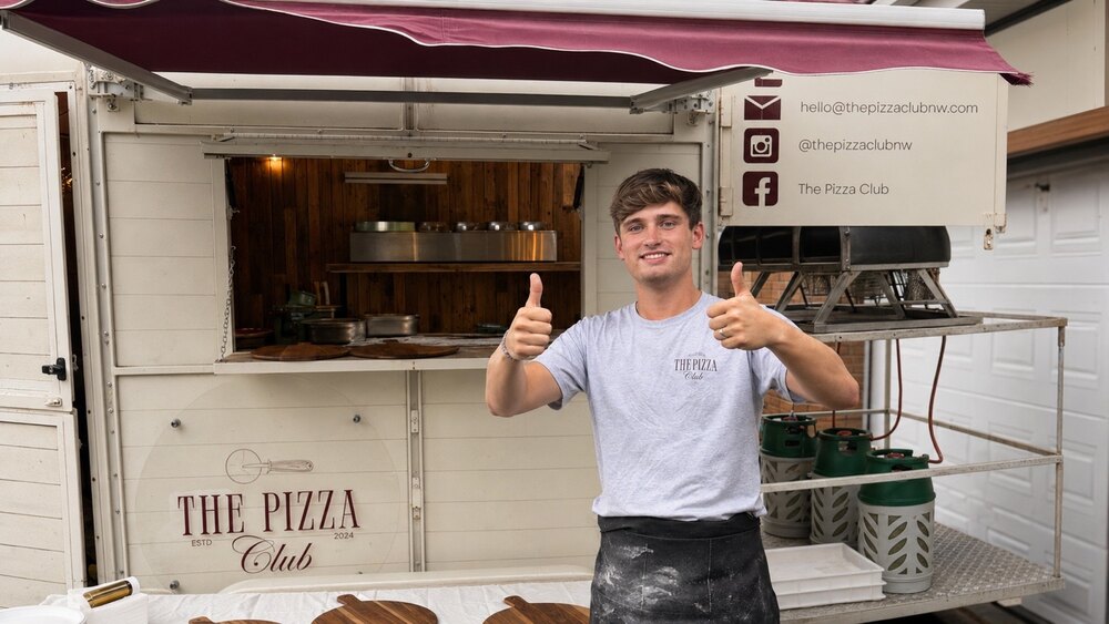 Tom standing in front of The Pizza Club trailer